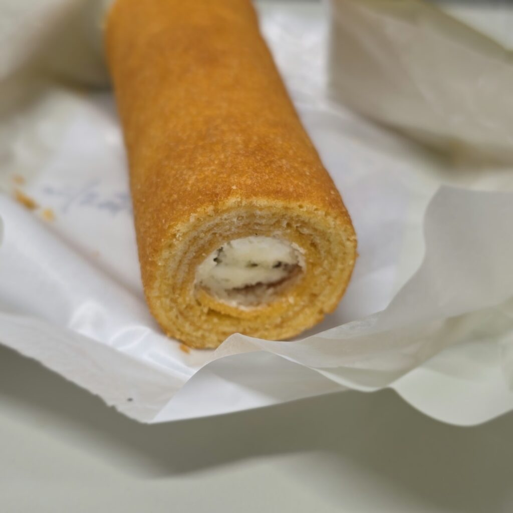 Close-up of the layered Baumkuchen and cream inside a Nagasaki Monogatari sweet.