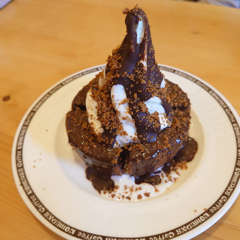 Komeda chocolate dessert topped with soft-serve ice cream.